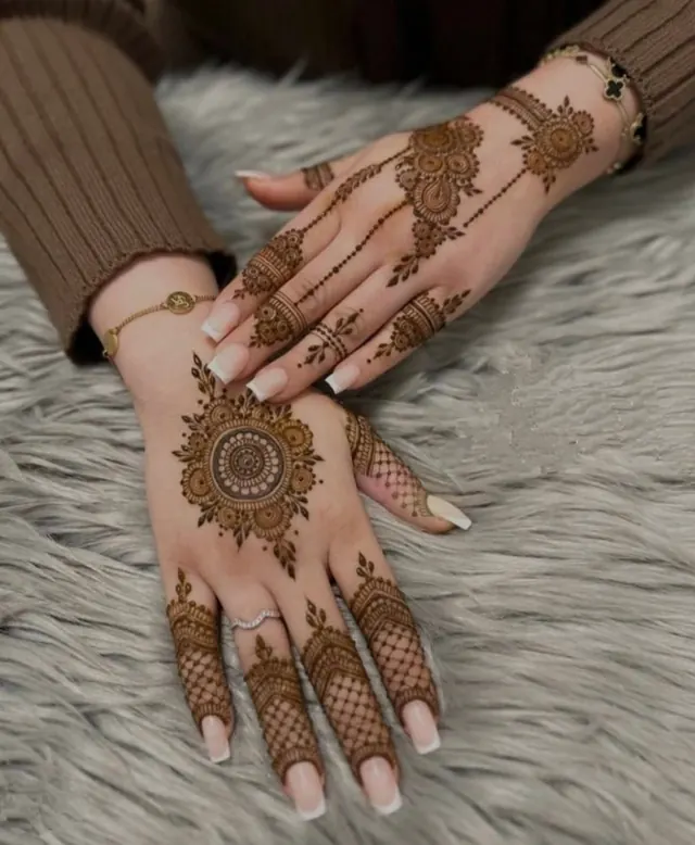 Elegant Arabic and floral mehendi design on hands by Anand Mehendi & Tattoo, Bhubaneswar