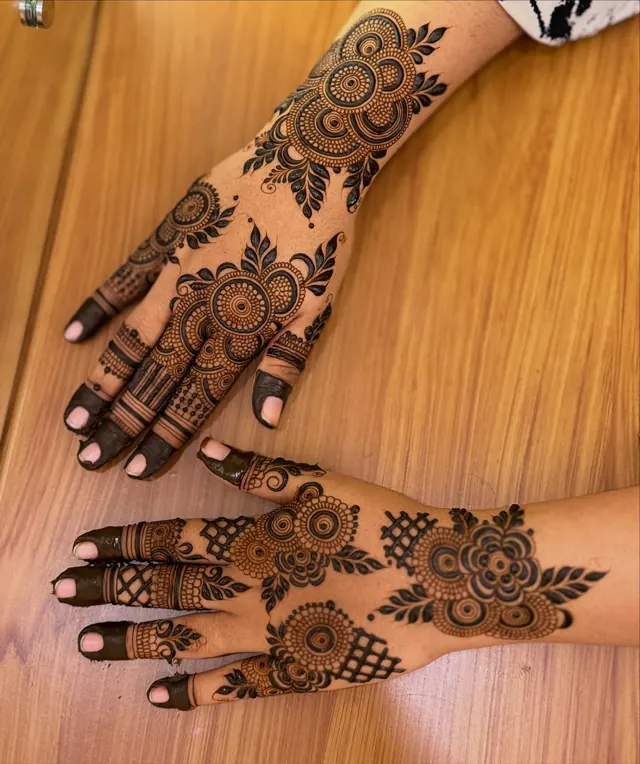 Elegant Arabic and floral mehendi design on hands by Anand Mehendi & Tattoo, Bhubaneswar