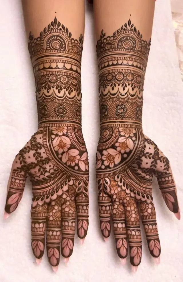 Elegant Arabic and floral mehendi design on hands by Anand Mehendi & Tattoo, Bhubaneswar