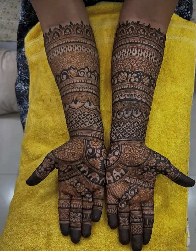 Traditional full-arm mehendi design by Anand Mehendi & Tattoo, Bhubaneswar