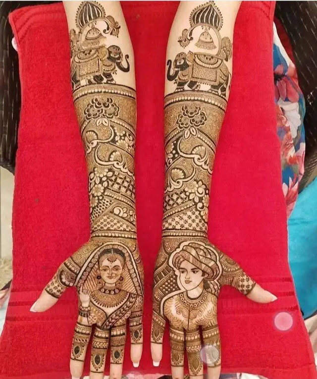 Detailed bridal mehendi design on both arms by Anand Mehendi & Tattoo, Bhubaneswar