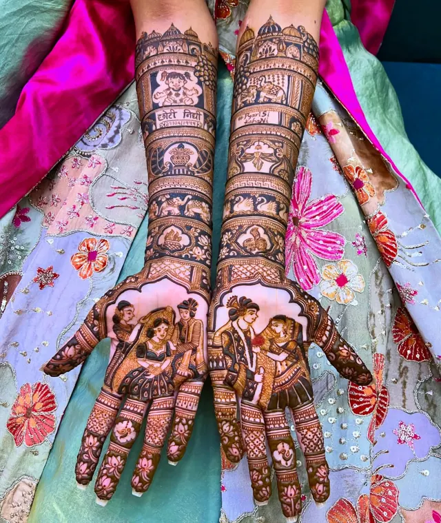 Detailed bridal mehendi design on both arms by Anand Mehendi & Tattoo, Bhubaneswar