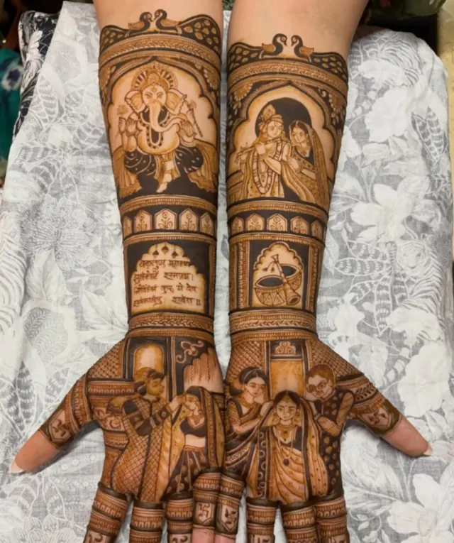 Detailed bridal mehendi design on both arms by Anand Mehendi & Tattoo, Bhubaneswar